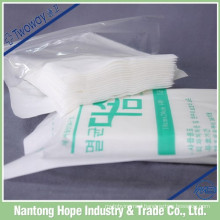 Disposable absorbent sterile nonwoven swabs